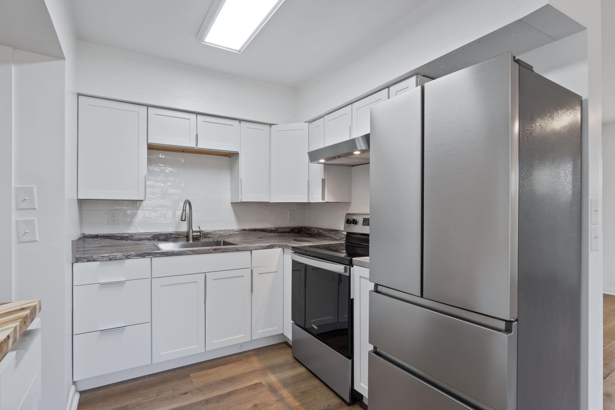 630 Shrewsbury Road Mary Esther, FL 32569 - Photo 11 of 39 a kitchen with stainless steel appliances granite countertop a refrigerator and a sink
