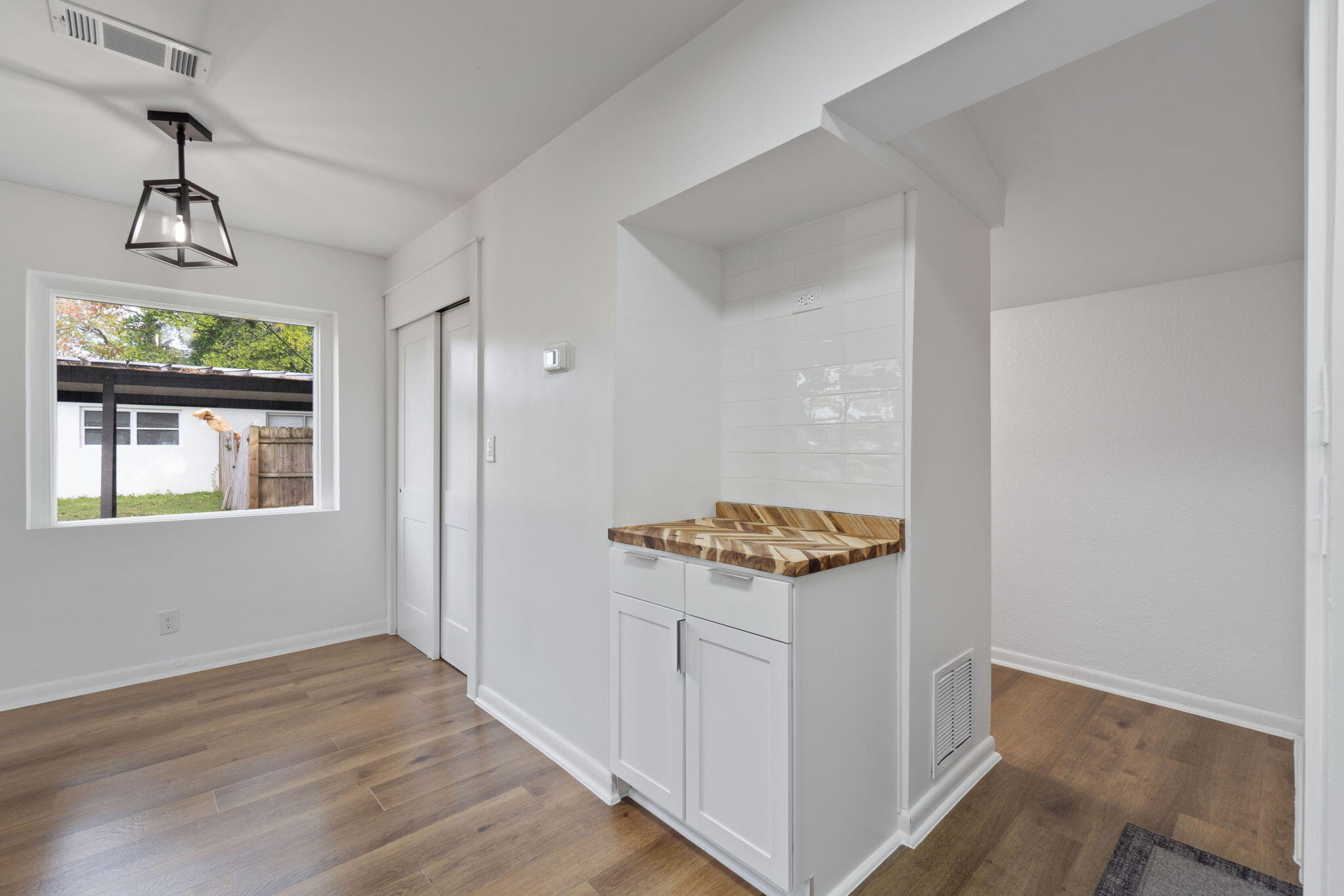630 Shrewsbury Road Mary Esther, FL 32569 - Photo 12 of 39 an entryway with wooden floor and cabinet