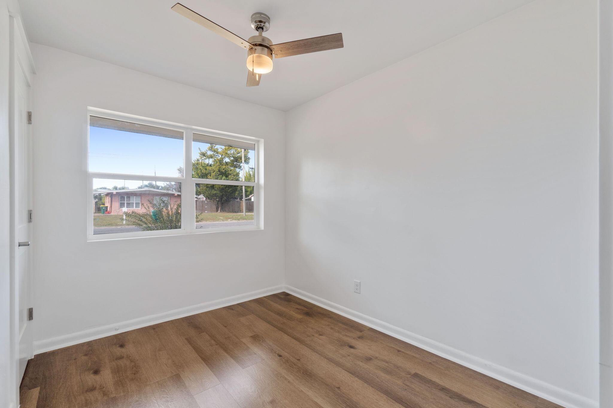 630 Shrewsbury Road Mary Esther, FL 32569 - Photo 18 of 39 an empty room with a window and ceiling fan