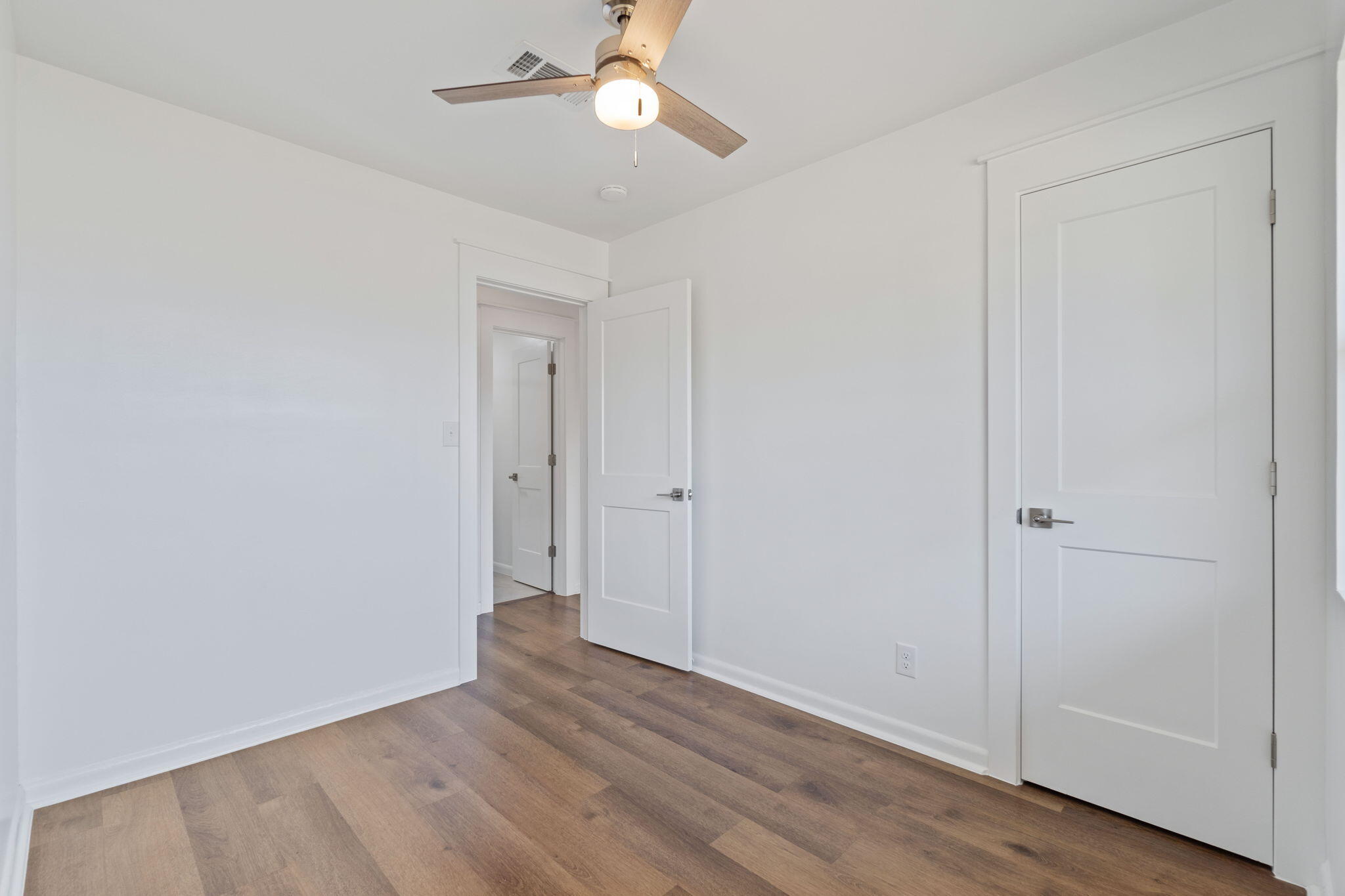 630 Shrewsbury Road Mary Esther, FL 32569 - Photo 19 of 39 a view of an empty room with wooden floor