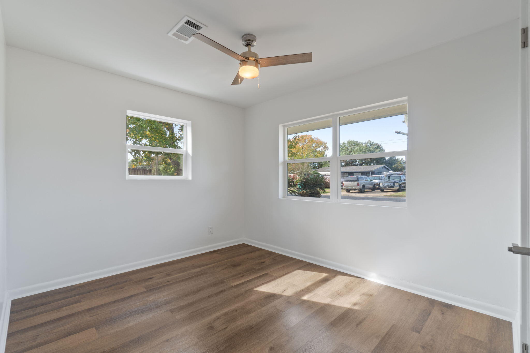 630 Shrewsbury Road Mary Esther, FL 32569 - Photo 23 of 39 a view of a big room with wooden floor and windows