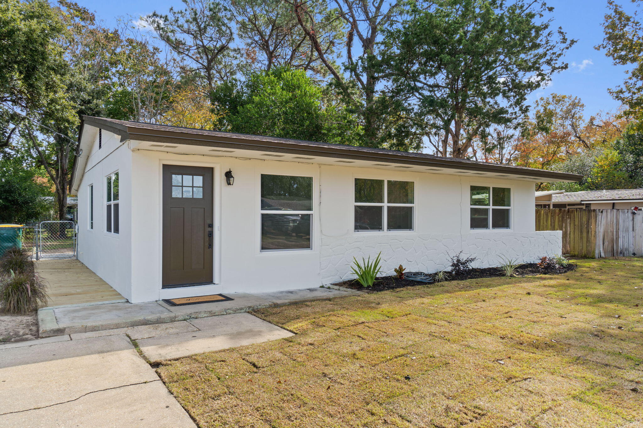 630 Shrewsbury Road Mary Esther, FL 32569 - Photo 3 of 39 a view of a house with backyard and trees
