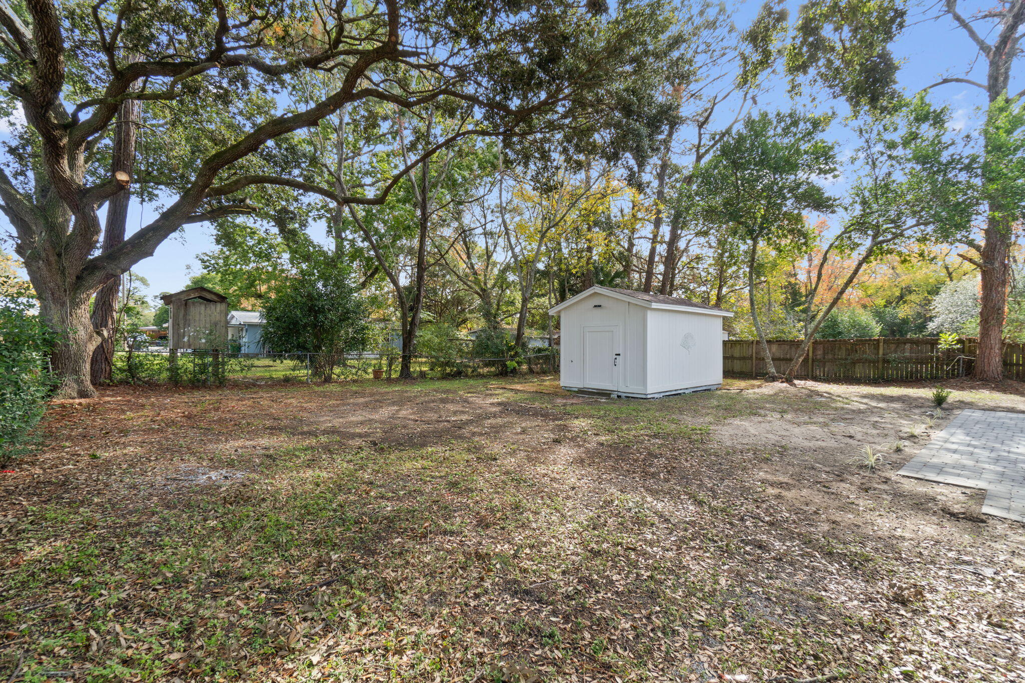 630 Shrewsbury Road Mary Esther, FL 32569 - Photo 34 of 39 a backyard of a house with a trees and garage