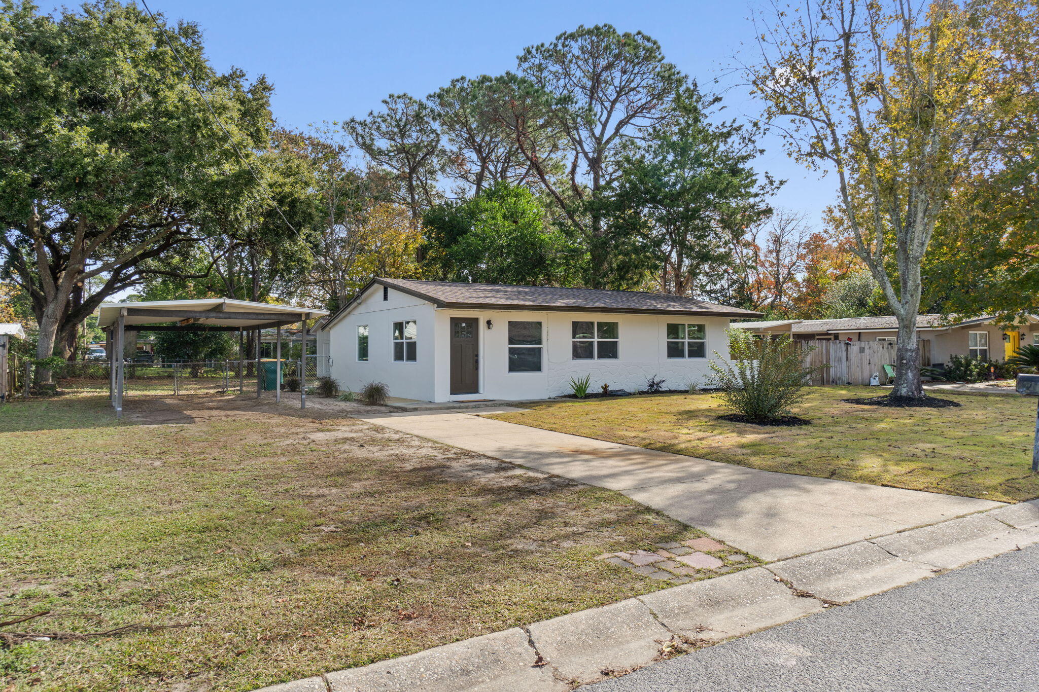 630 Shrewsbury Road Mary Esther, FL 32569 - Photo 36 of 39 a view of a house with a backyard and a tree