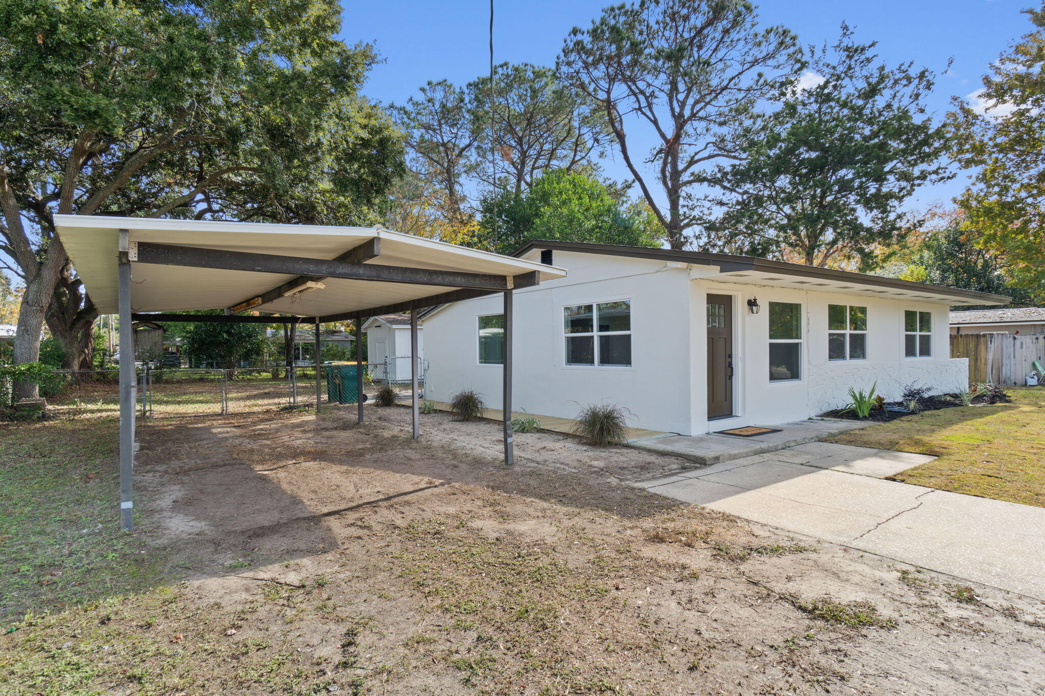 630 Shrewsbury Road Mary Esther, FL 32569 - Photo 38 of 39 a view of a house with a backyard and chairs