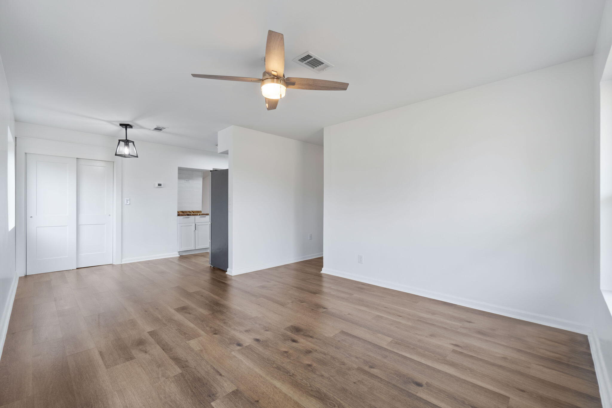 630 Shrewsbury Road Mary Esther, FL 32569 - Photo 5 of 39 a view of an empty room with wooden floor