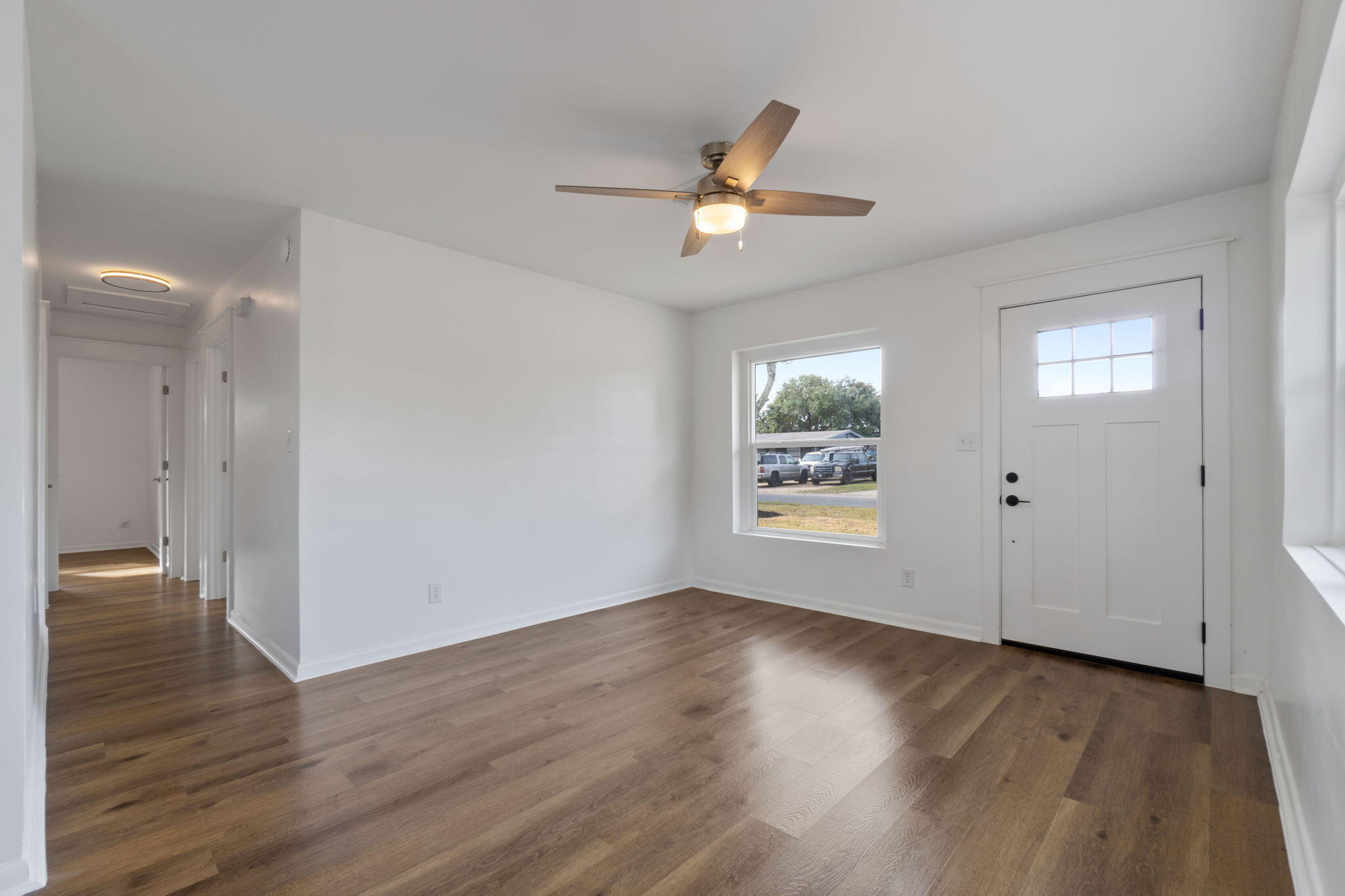 630 Shrewsbury Road Mary Esther, FL 32569 - Photo 7 of 39 a view of an empty room with wooden floor and a window