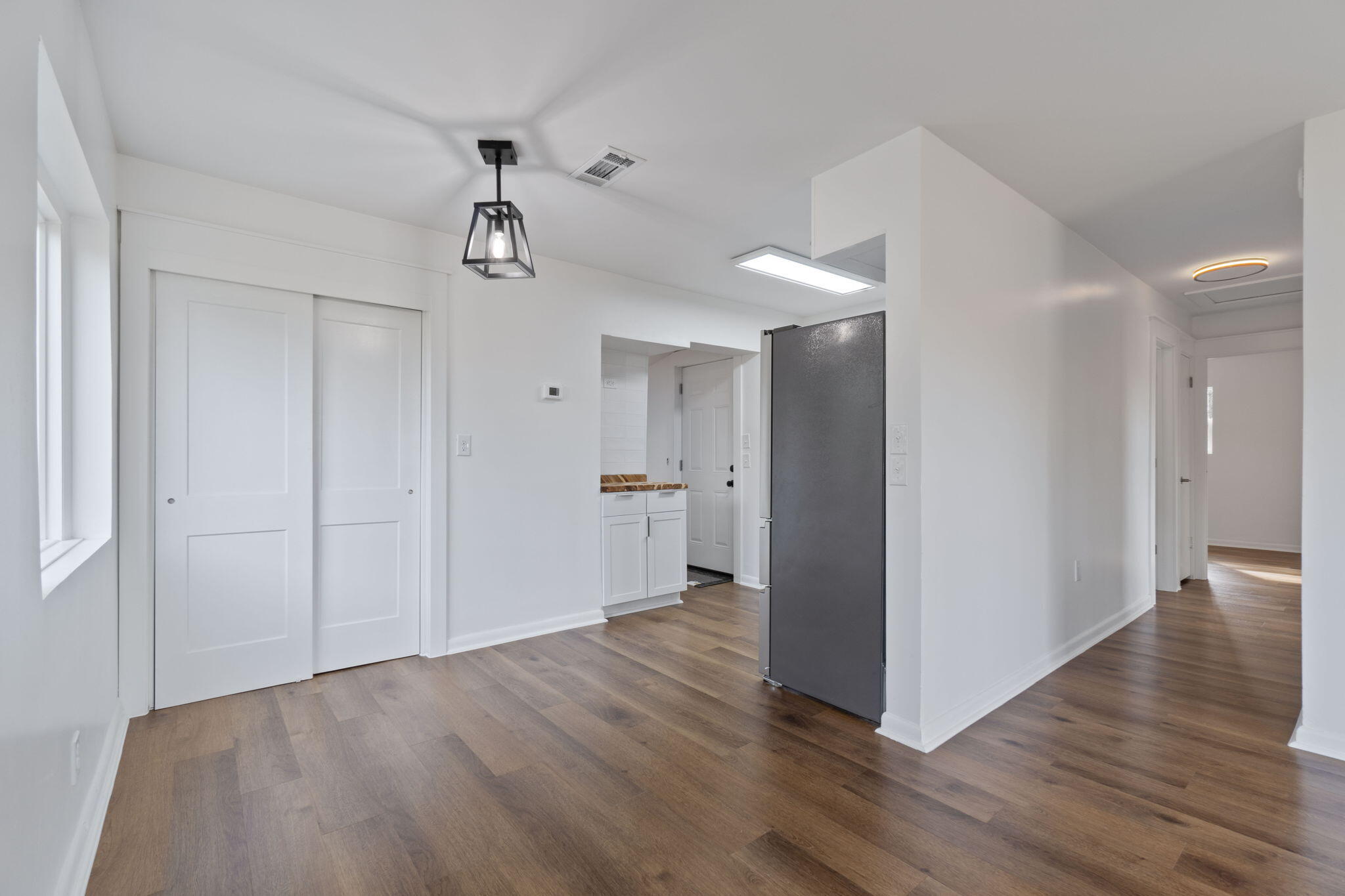 630 Shrewsbury Road Mary Esther, FL 32569 - Photo 8 of 39 a view of an empty room and wooden floor