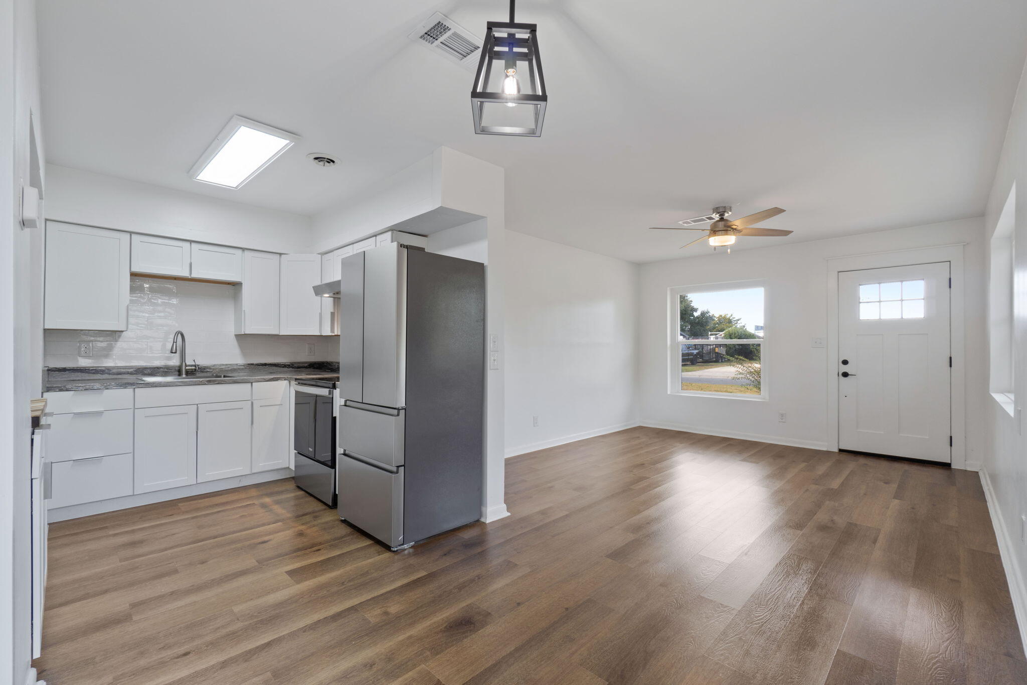 630 Shrewsbury Road Mary Esther, FL 32569 - Photo 9 of 39 a kitchen with a refrigerator and cabinets