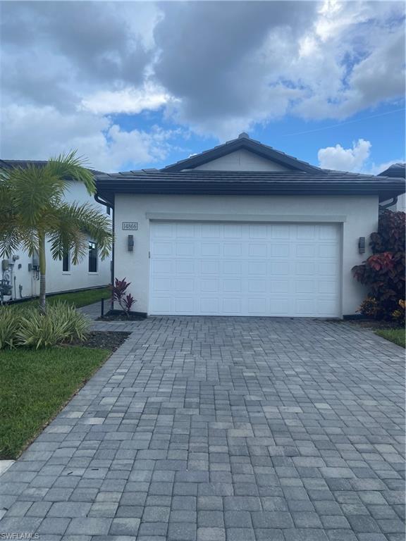 14866 Loggerhead Drive Naples, FL 34120 - Photo 1 of 16 a house view with a backyard space