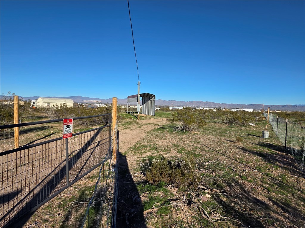 934 Elgin Road Golden Valley, AZ 86413 - Photo 5 of 23 View of yard featuring a mountain view and a view of rural / pastoral area