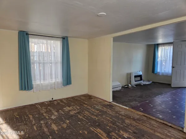 a living room with couch and a window