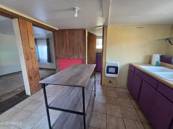 a bathroom with a double vanity sink toilet and a mirror