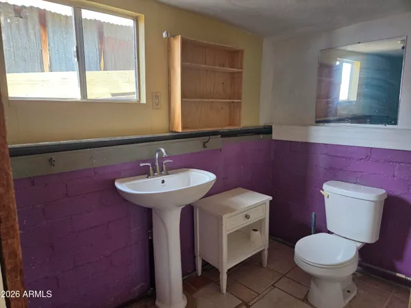 a bathroom with a sink and mirror