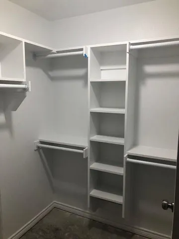 a view of an empty walk in closet
