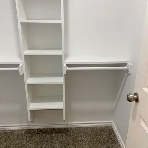 a view of an empty walk in closet