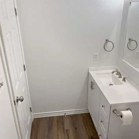 a bathroom with a sink and a mirror