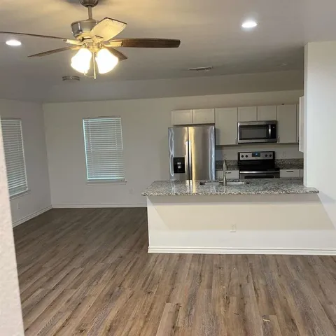 a view of kitchen and microwave