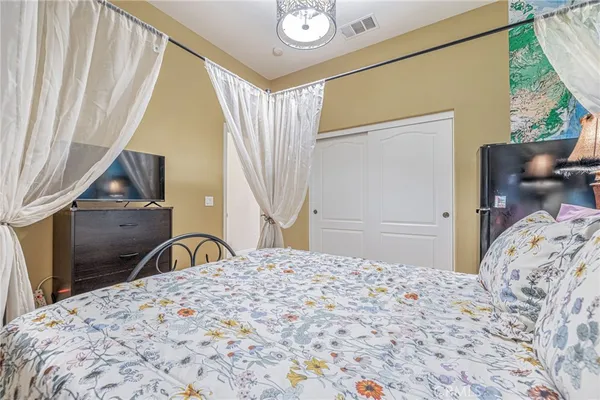 a bedroom with a bed and window
