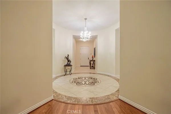 a kitchen with kitchen island granite countertop wooden cabinets a dining table and chairs