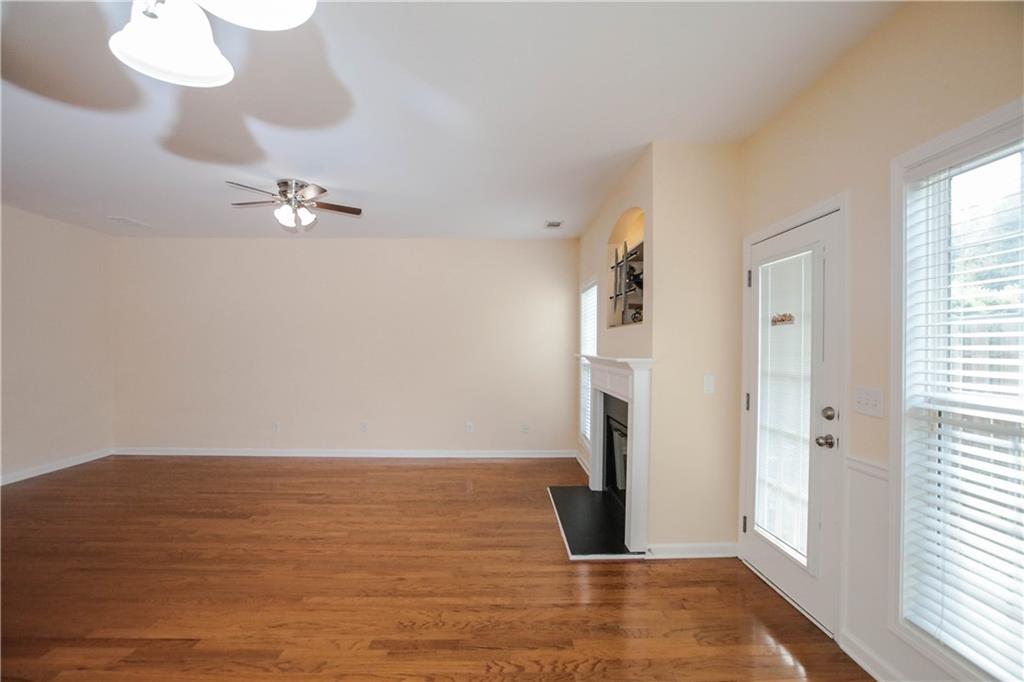 3801 Thayer Trace Duluth, GA 30096 - Photo 11 of 44 a view of a room with wooden floor and window