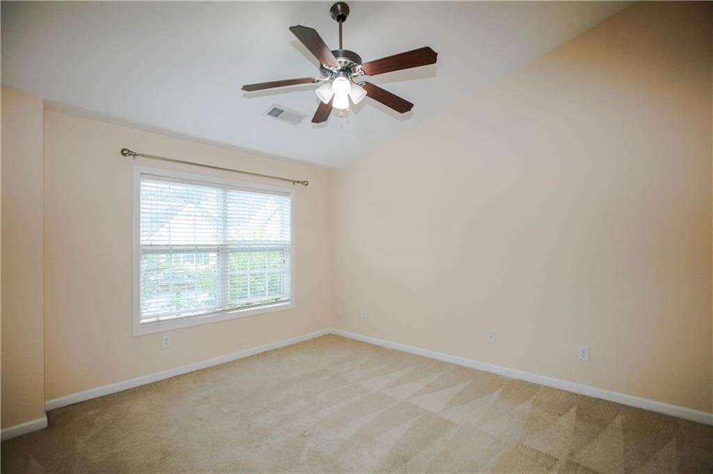 3801 Thayer Trace Duluth, GA 30096 - Photo 22 of 44 an empty room with a window and a fan