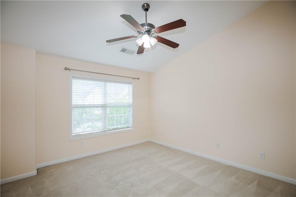 3801 Thayer Trace Duluth, GA 30096 - Photo 23 of 44 an empty room with a window and a ceiling fan