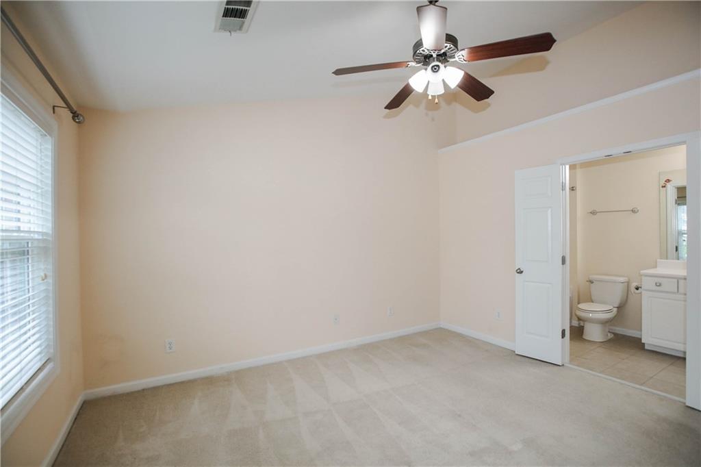 3801 Thayer Trace Duluth, GA 30096 - Photo 24 of 44 an empty room with a window and a fan