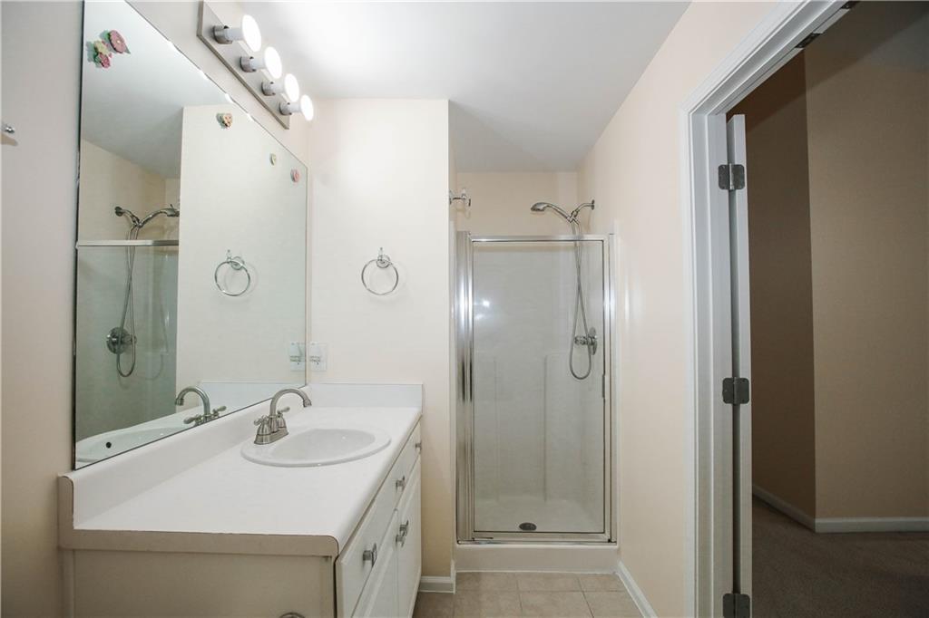 3801 Thayer Trace Duluth, GA 30096 - Photo 28 of 44 a bathroom with a sink and a mirror