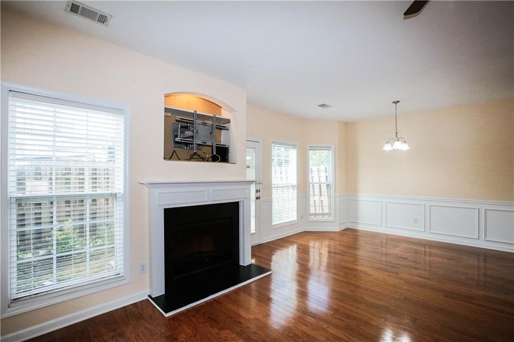 3801 Thayer Trace Duluth, GA 30096 - Photo 6 of 44 a living room with wooden floor and a fireplace