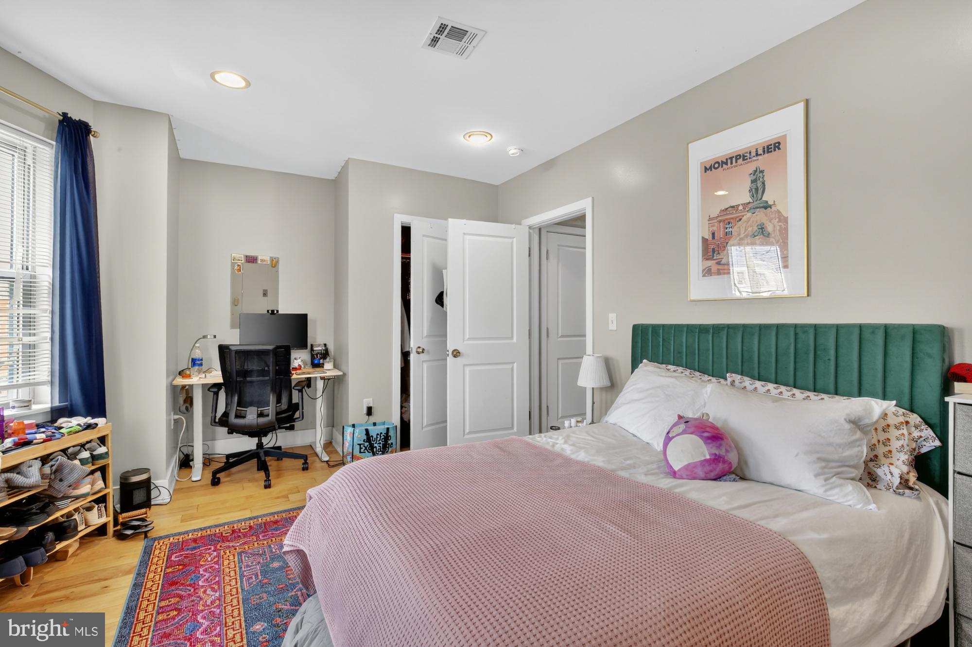 709 North 3rd Street, Unit 3 Philadelphia, PA 19123 - Photo 12 of 17 a bedroom with a bed and wooden floor