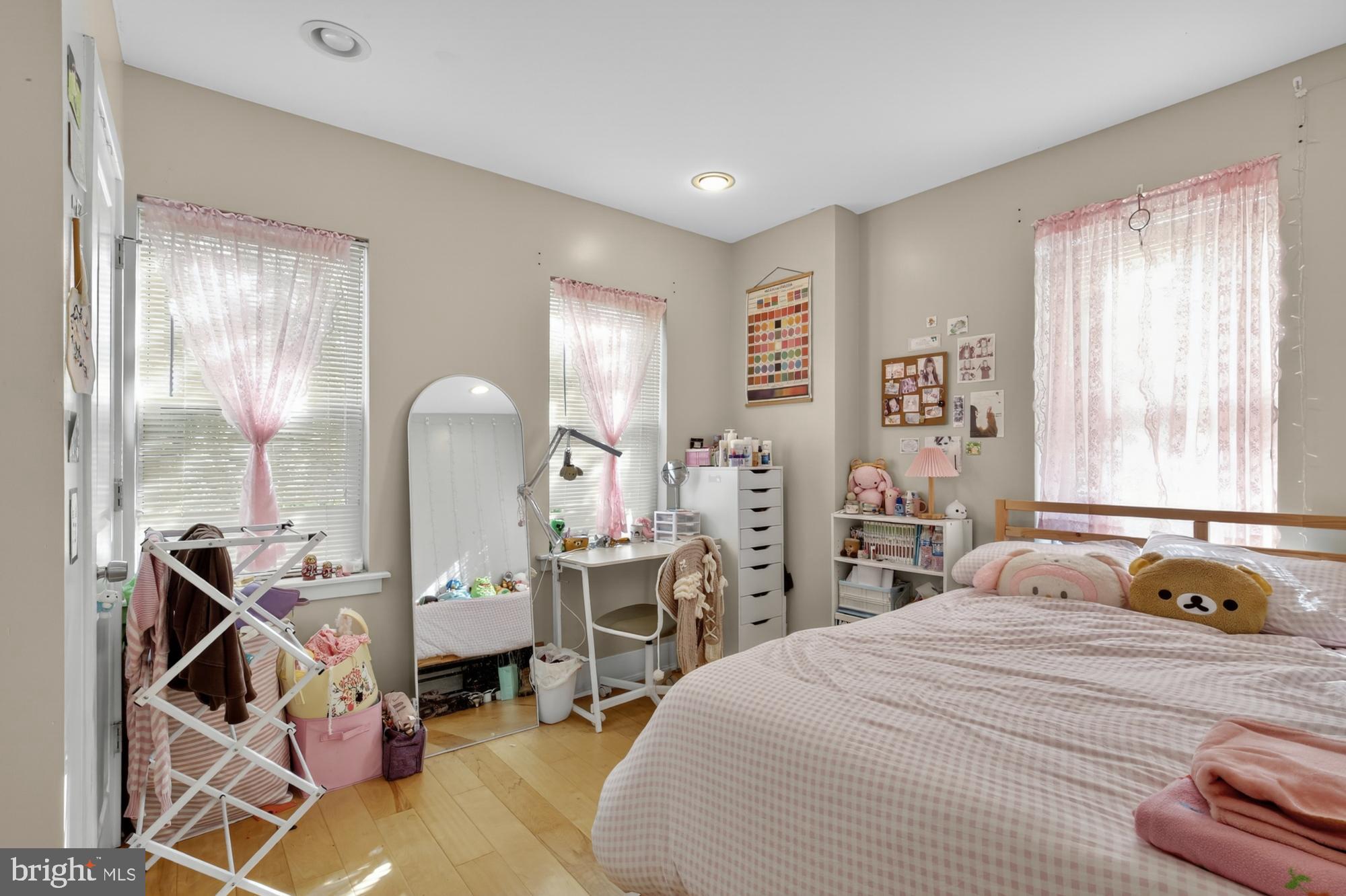 709 North 3rd Street, Unit 3 Philadelphia, PA 19123 - Photo 13 of 17 a bedroom with a bed a table and chair