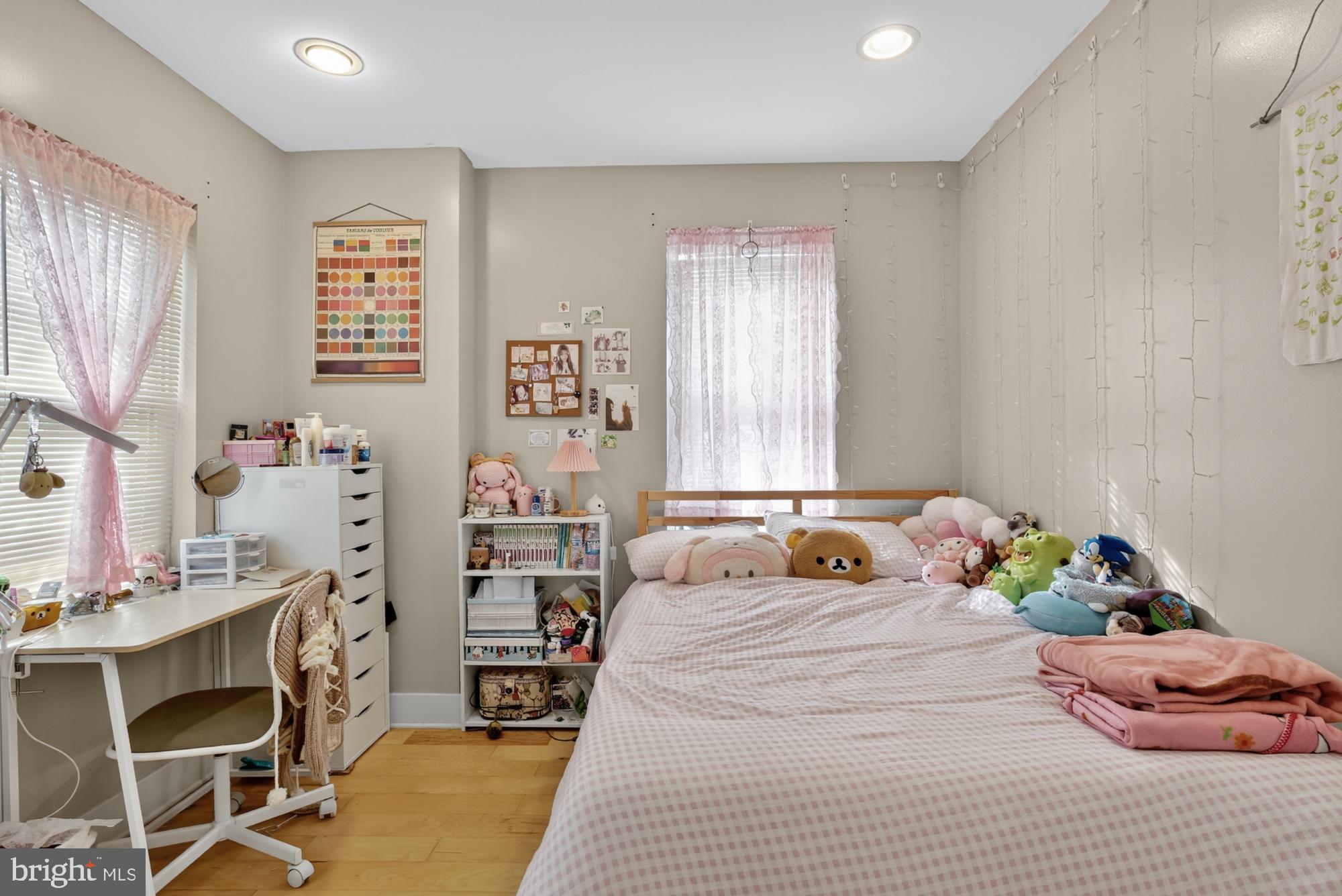 709 North 3rd Street, Unit 3 Philadelphia, PA 19123 - Photo 14 of 17 a bedroom with a bed and a table