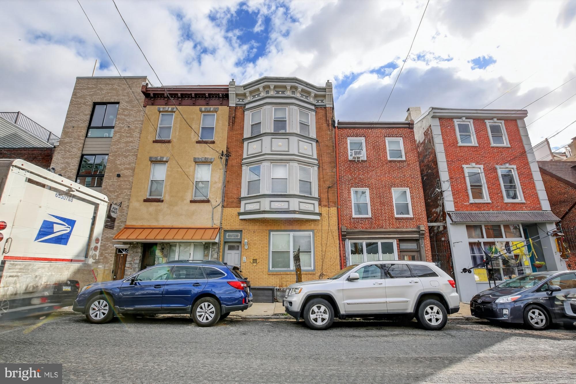 709 North 3rd Street, Unit 3 Philadelphia, PA 19123 - Photo 17 of 17 a front view of a residential apartment building with a parking space