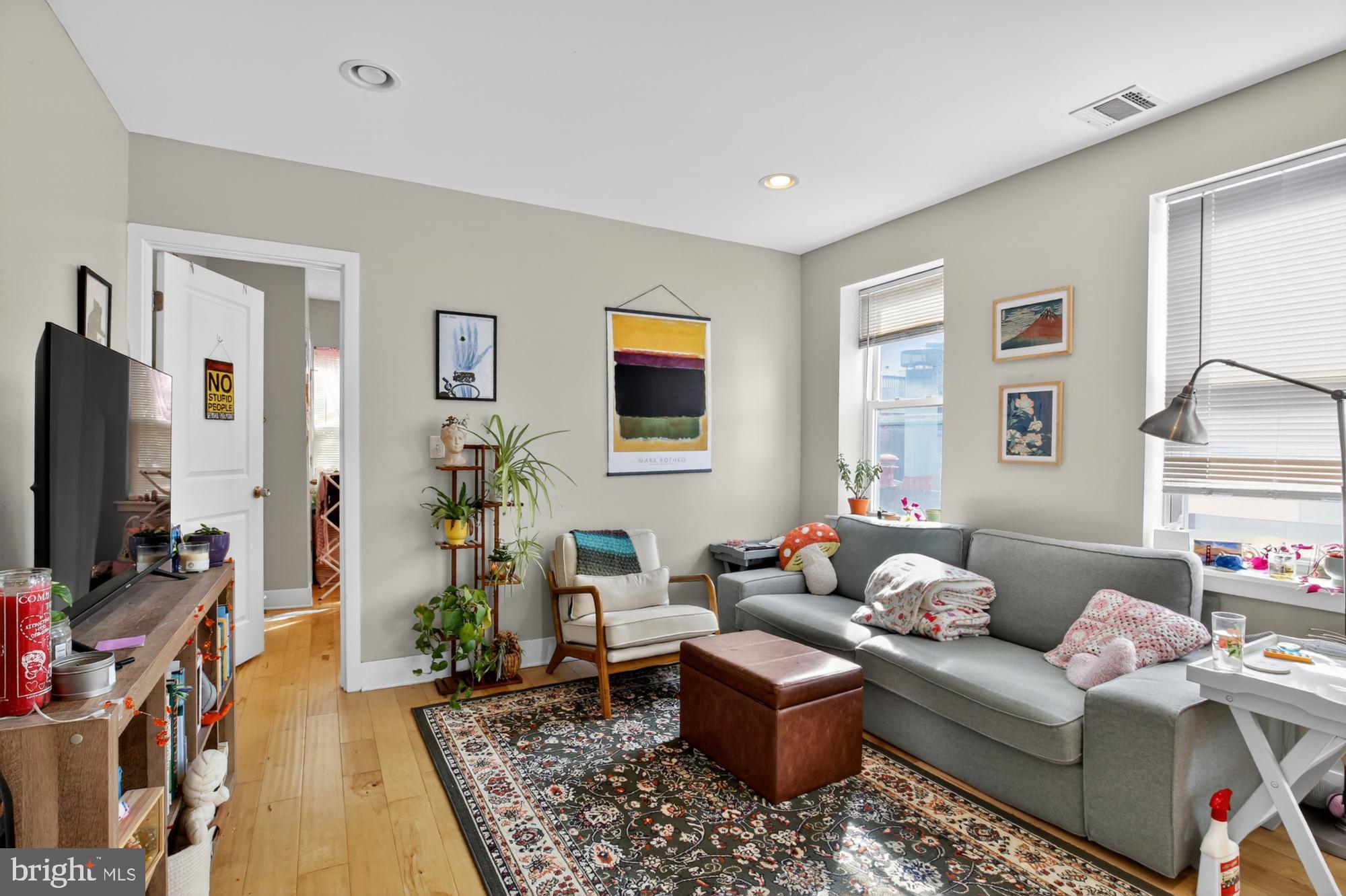709 North 3rd Street, Unit 3 Philadelphia, PA 19123 - Photo 2 of 17 a living room with furniture and a flat screen tv