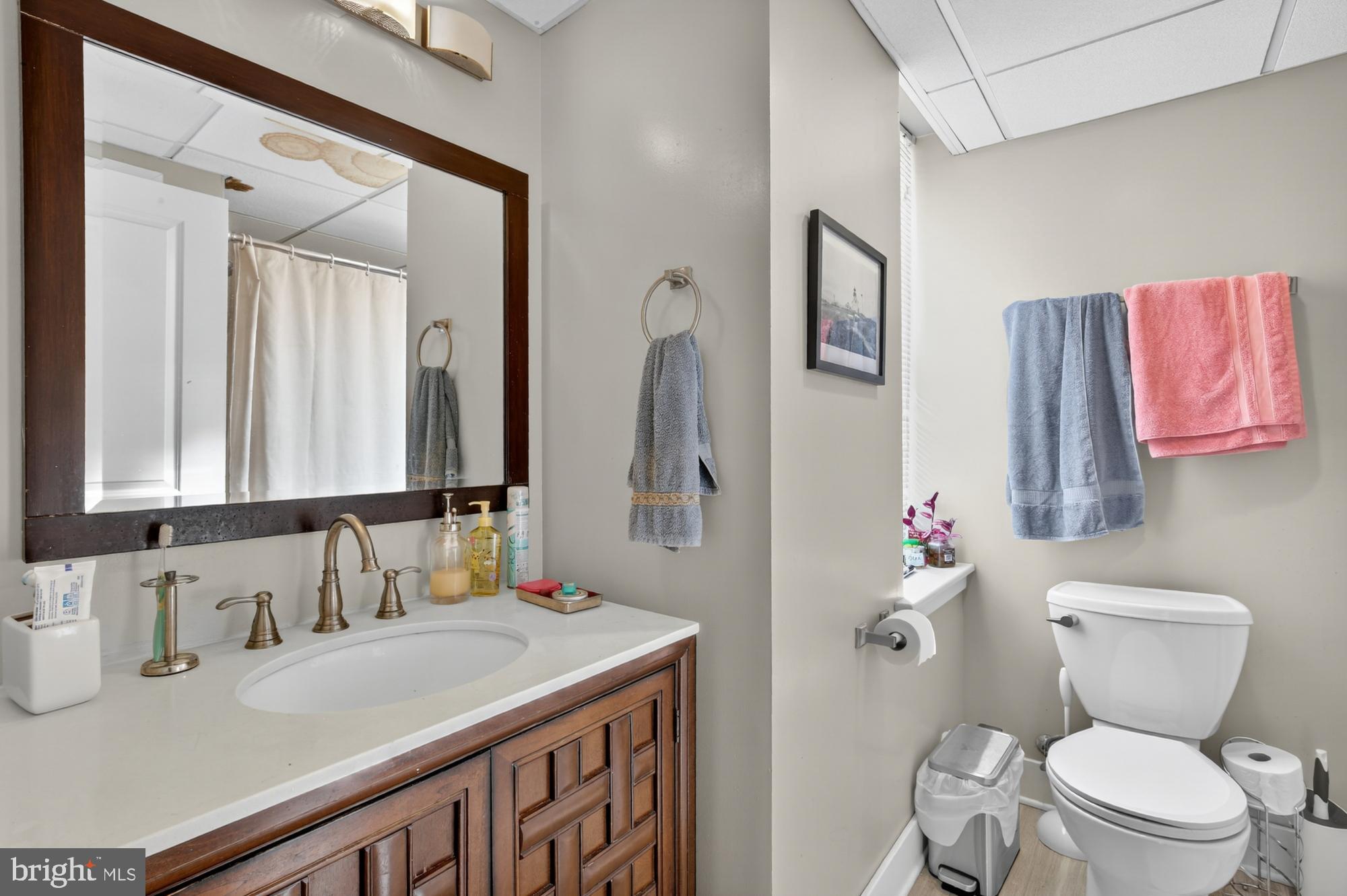 709 North 3rd Street, Unit 3 Philadelphia, PA 19123 - Photo 5 of 17 a bathroom with a granite countertop sink mirror vanity and toilet