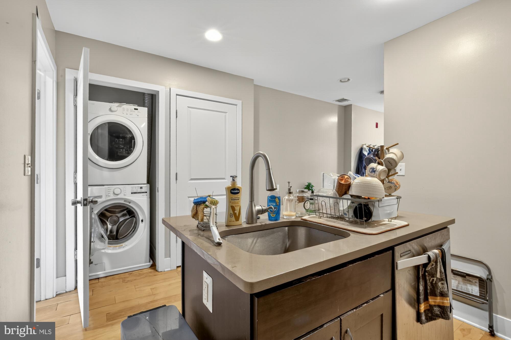 709 North 3rd Street, Unit 3 Philadelphia, PA 19123 - Photo 9 of 17 a kitchen with a sink a stove and a window