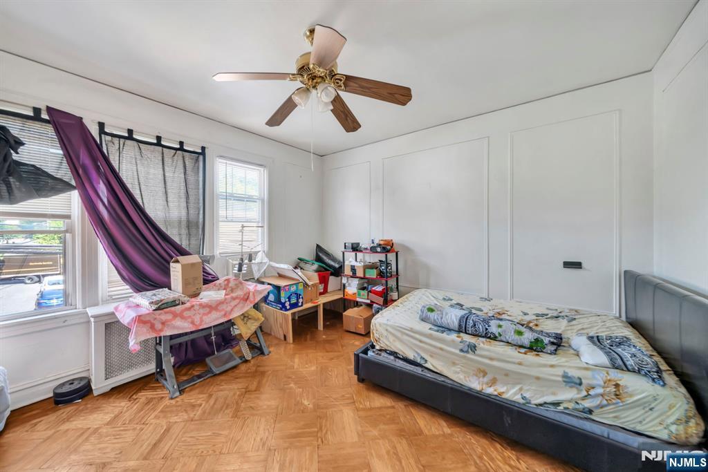 688 Passaic Avenue Nutley, NJ 07110 - Photo 17 of 42 a living room with furniture and a chandelier