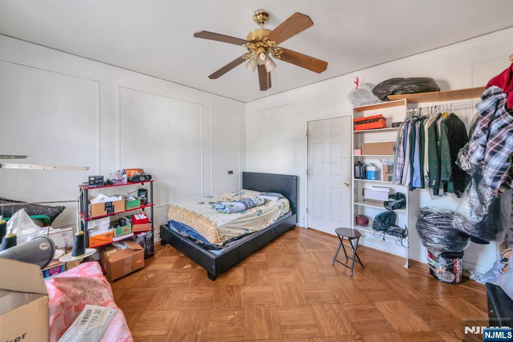 688 Passaic Avenue Nutley, NJ 07110 - Photo 18 of 42 a living room with lots of furniture and a rug