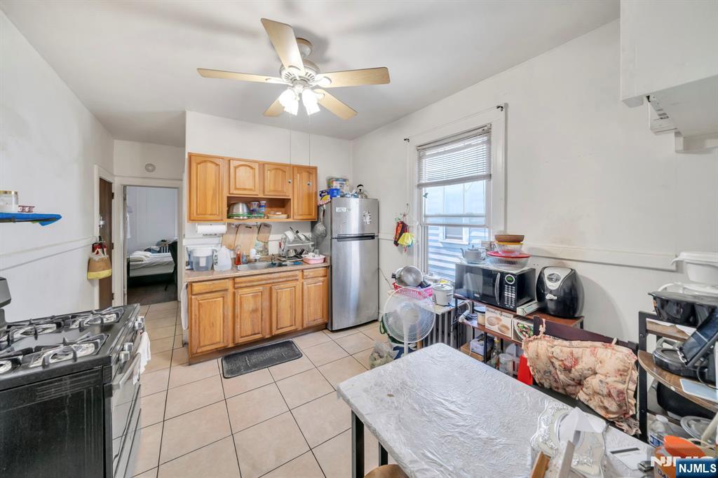 688 Passaic Avenue Nutley, NJ 07110 - Photo 22 of 42 a kitchen with a sink appliances and cabinets