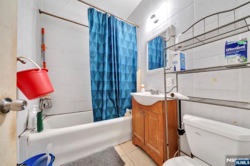 688 Passaic Avenue Nutley, NJ 07110 - Photo 26 of 42 a bathroom with a sink and a mirror