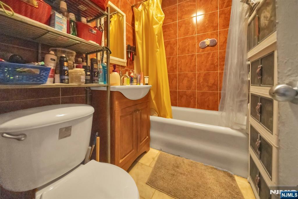 688 Passaic Avenue Nutley, NJ 07110 - Photo 30 of 42 a bathroom with a sink and bathtub