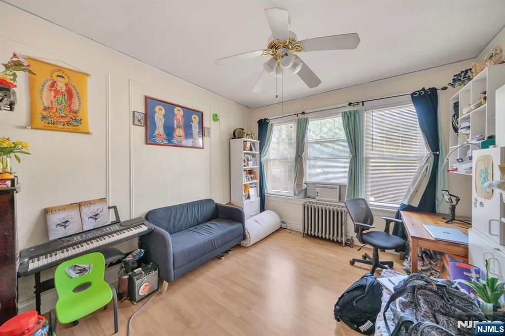 688 Passaic Avenue Nutley, NJ 07110 - Photo 34 of 42 a living room with furniture and a window