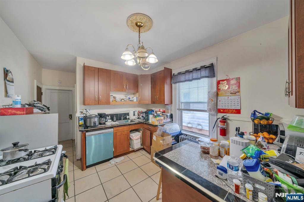 688 Passaic Avenue Nutley, NJ 07110 - Photo 38 of 42 a kitchen with lots of counter top space and appliances