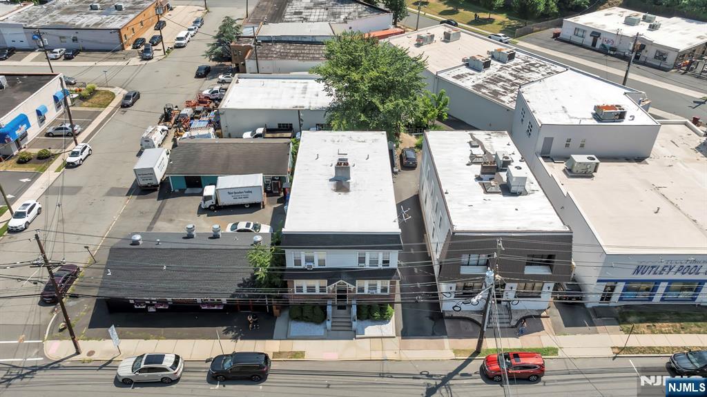 688 Passaic Avenue Nutley, NJ 07110 - Photo 5 of 42 an aerial view of a building with cars parked