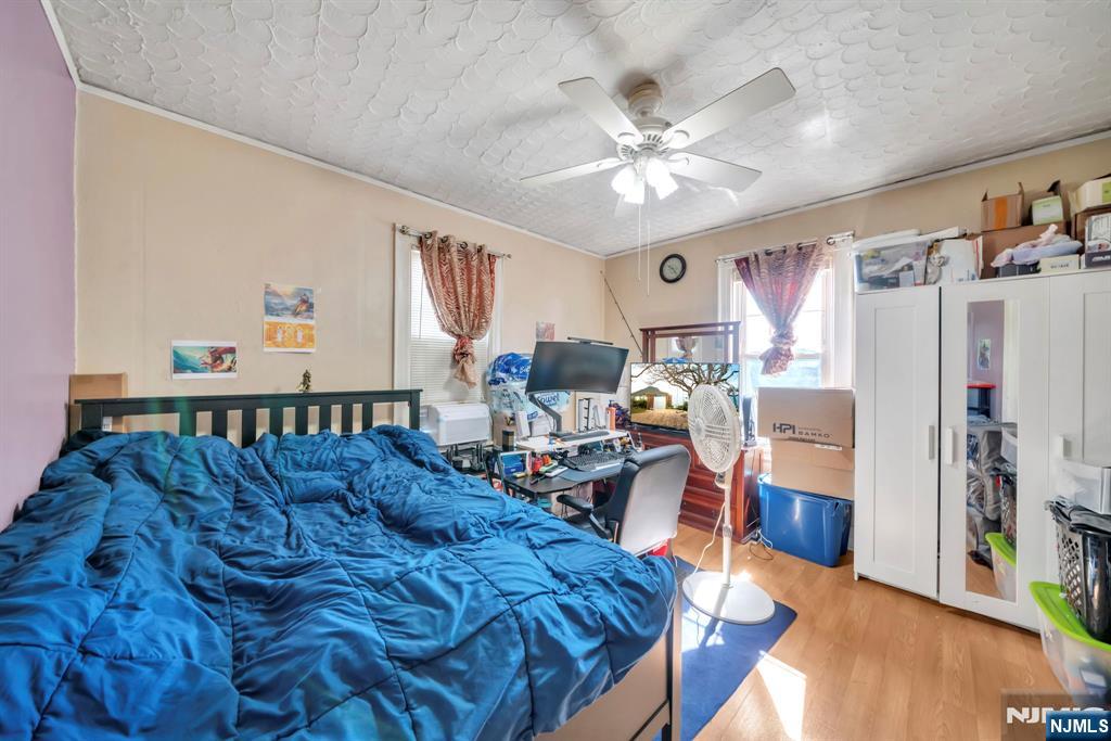 688 Passaic Avenue Nutley, NJ 07110 - Photo 10 of 42 a living room with furniture and wooden floor