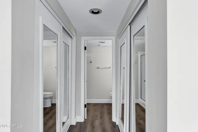 a view of a bathroom with wooden floor