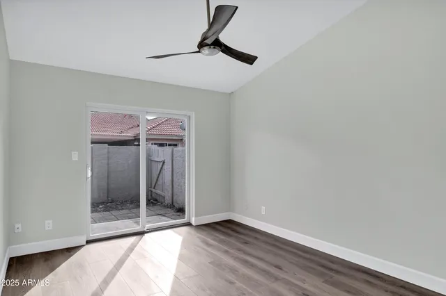 a view of an empty room with glass door