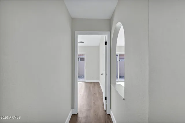 a view of a bathroom from a hallway