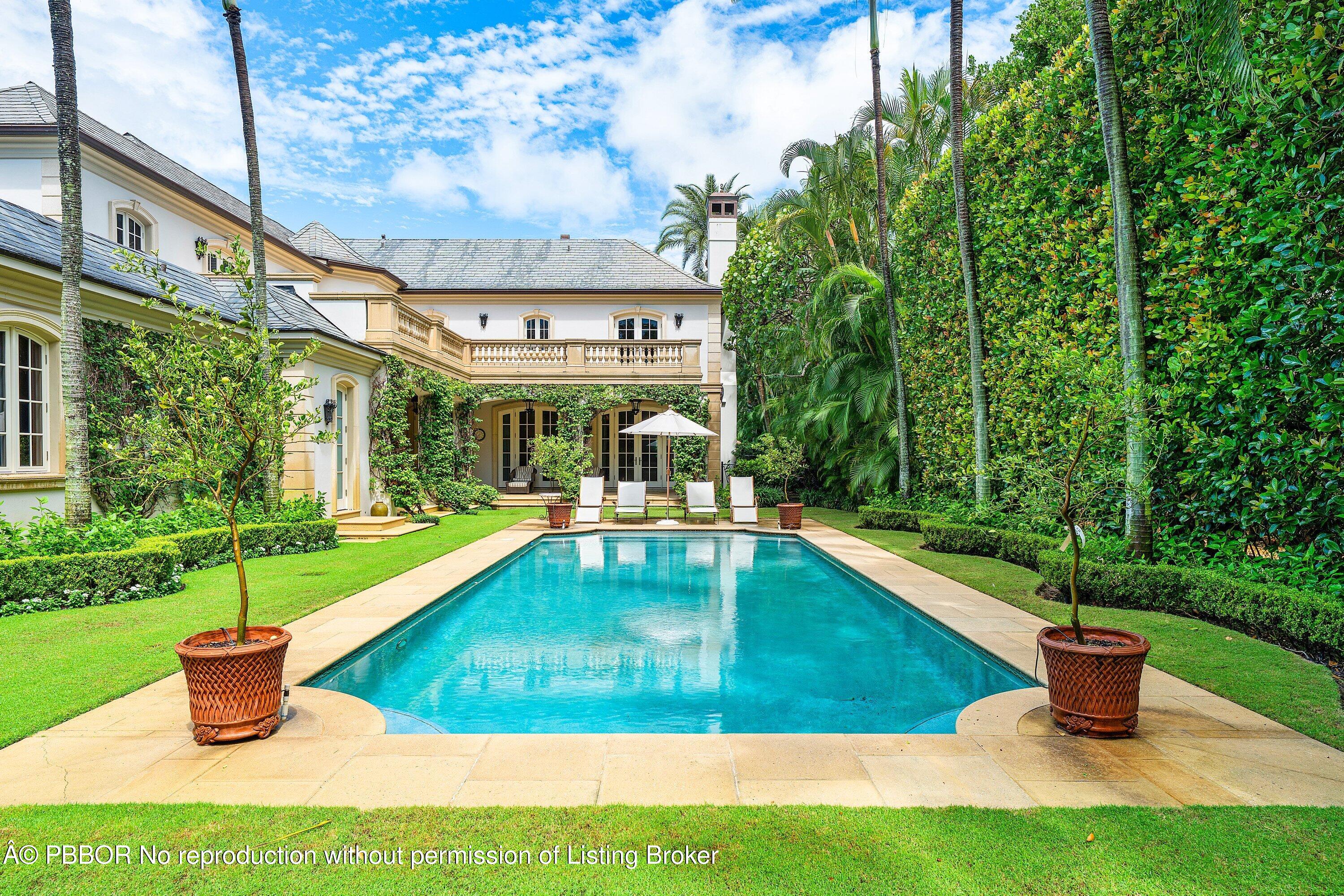 242 Wells Road Palm Beach, FL 33480 - Photo 37 of 54 a view of a backyard with a sitting area